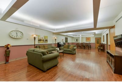 Interior common area with seating and dining setup