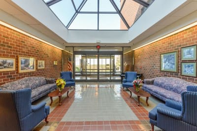 Bright and welcoming lobby with sofas and floral arrangements