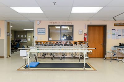 Interior view of a physical therapy room with equipment