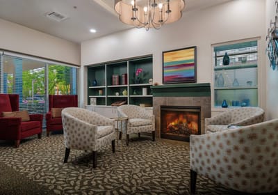 Cozy common area with seating and a fireplace