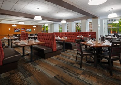 Dining area with neatly arranged tables and booths