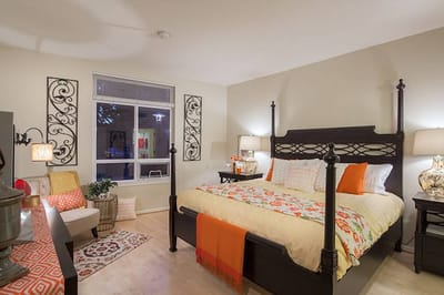 Cozy private room with a bed and decorative elements