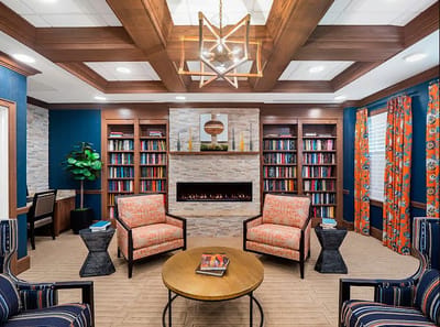 Cozy common area with bookshelves and seating