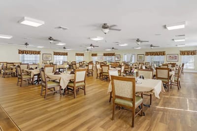 Spacious dining room with tables set for meals