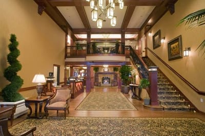 Elegant lobby with seating and a staircase