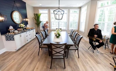 Residents and staff enjoying a meal in a dining area