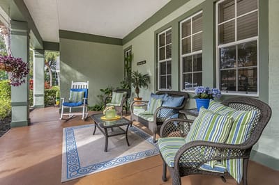 Cozy outdoor seating area with plants