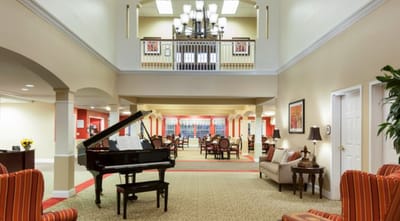 Interior view of a welcoming common area with piano