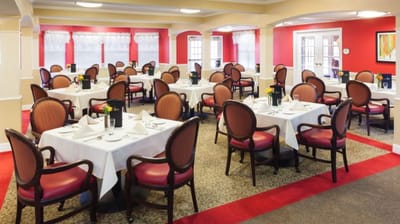 Bright dining room set for service with tables and chairs