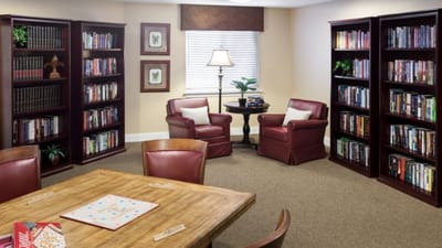 Cozy common area with bookshelves and seating