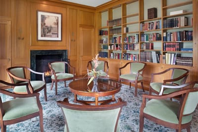 Cozy library area with seating and bookshelves