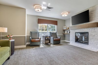 Bright common area with comfortable seating and fireplace