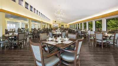 Bright dining room with tables set for meals
