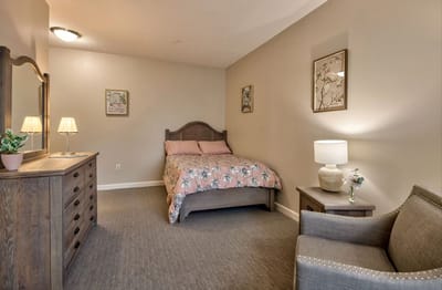 A cozy, well-furnished private room with a bed and decor