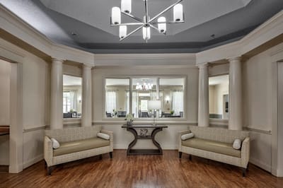 Bright common area with seating and elegant lighting