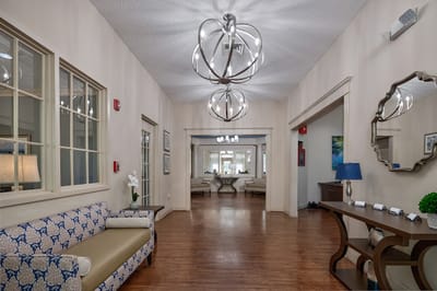 Well-lit lobby area with seating and decorative elements