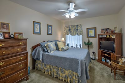 A cozy resident room with warm decor