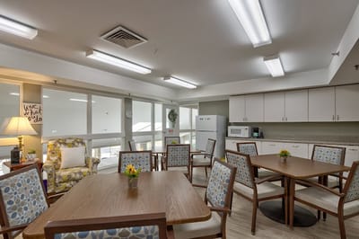 Bright common area with tables and chairs