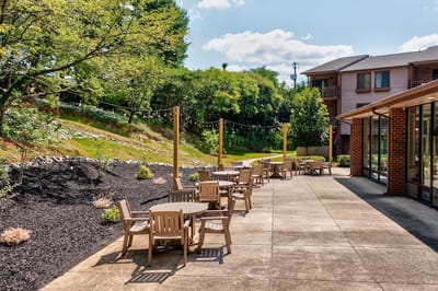 Outdoor seating area with tables and chairs