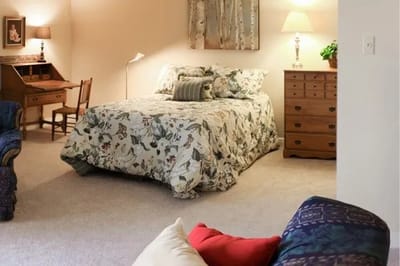 Cozy resident room with floral decor and a desk