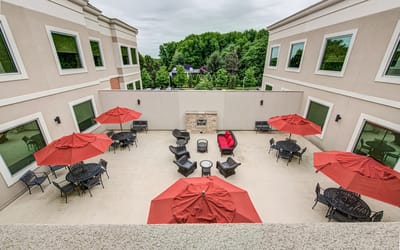 Outdoor seating area with umbrellas and lounge chairs