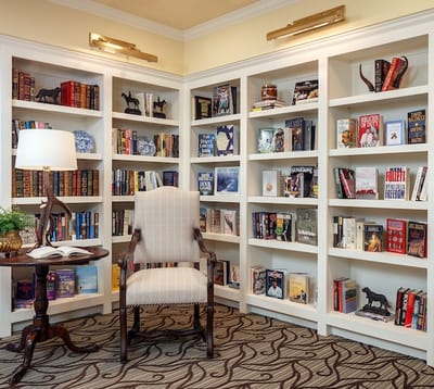 Cozy library corner with bookshelves and a chair