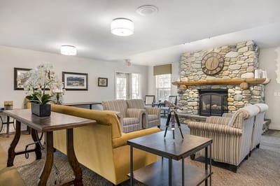 Cozy common area with seating and fireplace