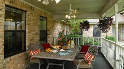 Outdoor dining area with a table set for a meal