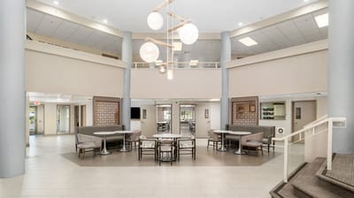 Bright common area with seating and modern decor