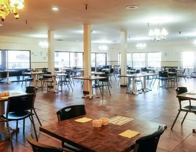 Dining area with tables and chairs, well-lit space