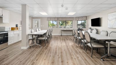 Bright common area with tables and chairs