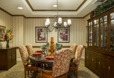 Elegant dining room with a chandelier and decorated table