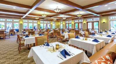 Bright dining area with tables set for meals