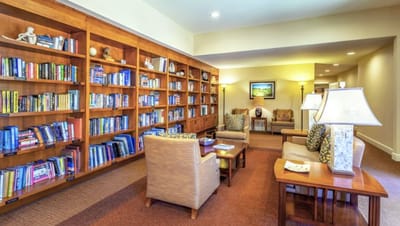 Cozy common area with bookshelves and seating