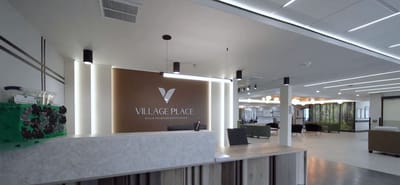 Modern lobby area of Village Place with reception desk