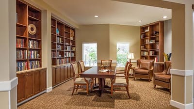 Cozy common area with bookshelves and seating