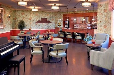 Comfortable common area with chairs and piano