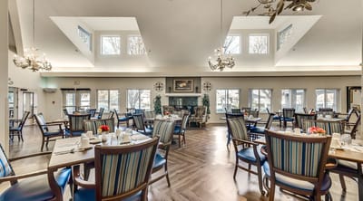Bright dining room with tables set for meals