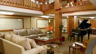 Indoor common area with seating and a piano