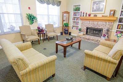 Comfortable common area with seating and a fireplace