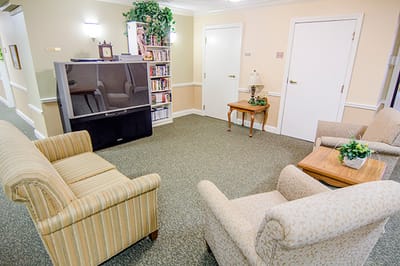 Common area with seating and bookcase