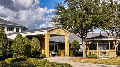 Exterior view of Heron Club entrance with landscaping