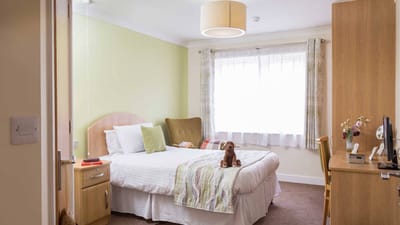 Cozy resident room with a bed and furniture