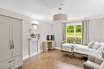 A well-furnished resident room with a view.