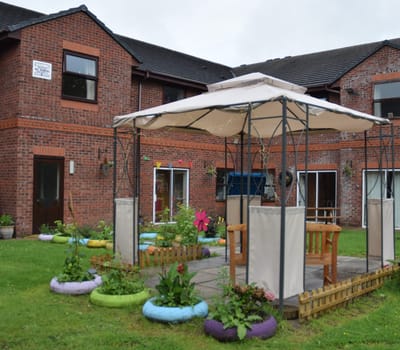 Outdoor garden area with seating and plants