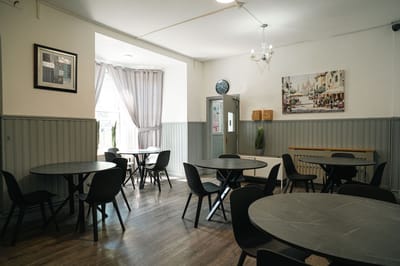 Interior view of a dining area with tables and chairs