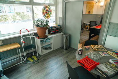 Activity room with games and seating for residents