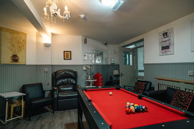 Interior lounge with billiard table and seating