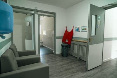 Interior hallway of a care facility with seating