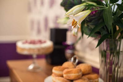 A beautifully arranged dessert table with cake and pastries